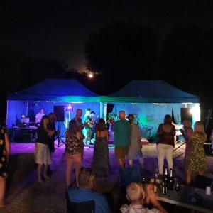 The Courrrjettes perform under a rising moon